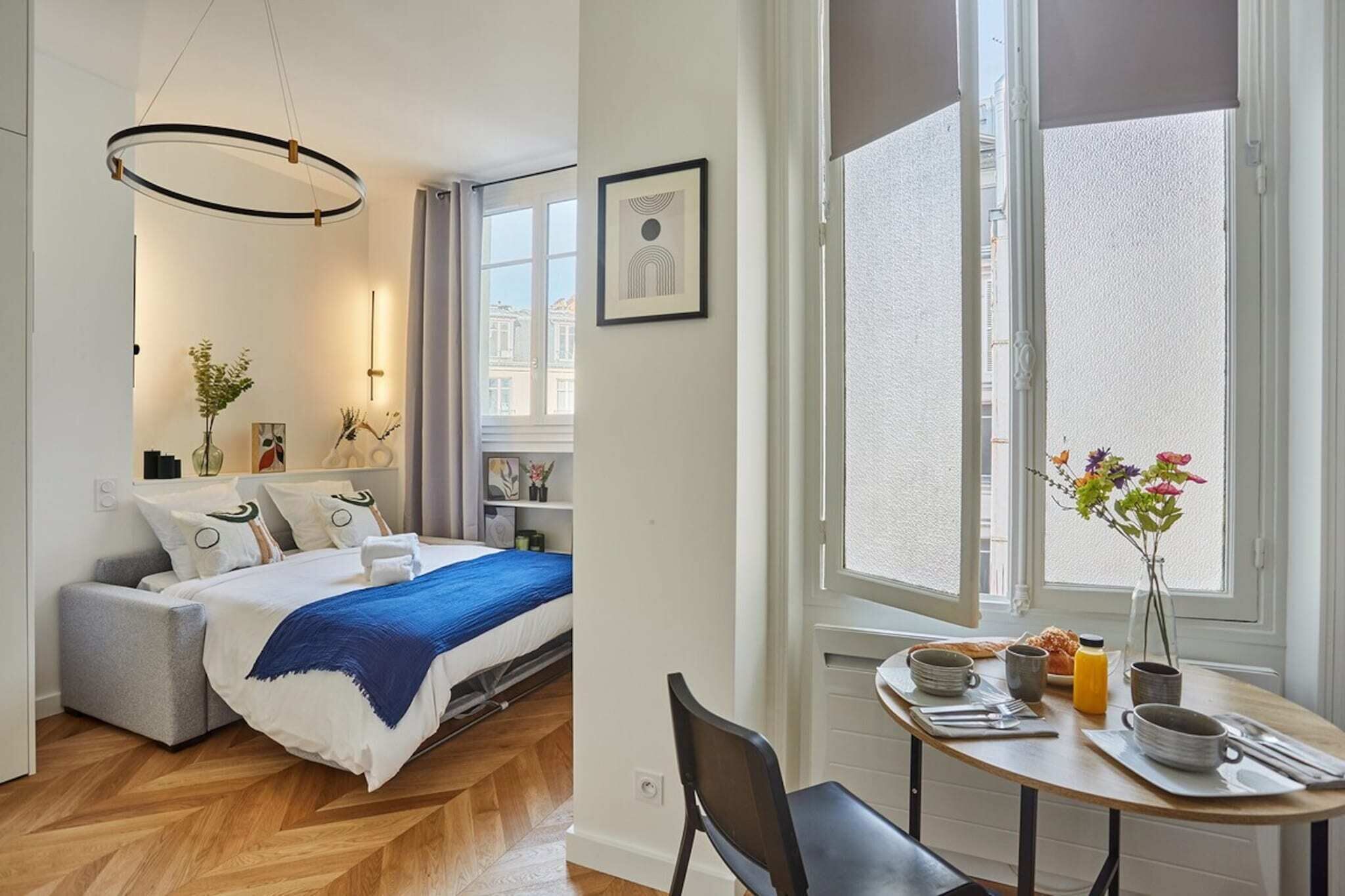 Desk, iron/ironing board, bed sheets