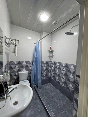 Shower, hair dryer, slippers, towels - OKS hotel (Tashkent)