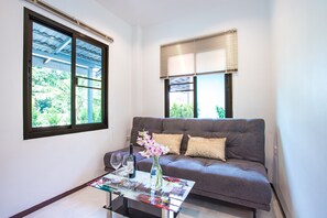 Bungalow Deluxe, vue jardin | Salle de séjour