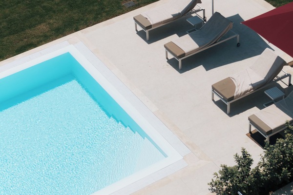 Seasonal outdoor pool, open 9:00 AM to 8:00 PM, pool umbrellas