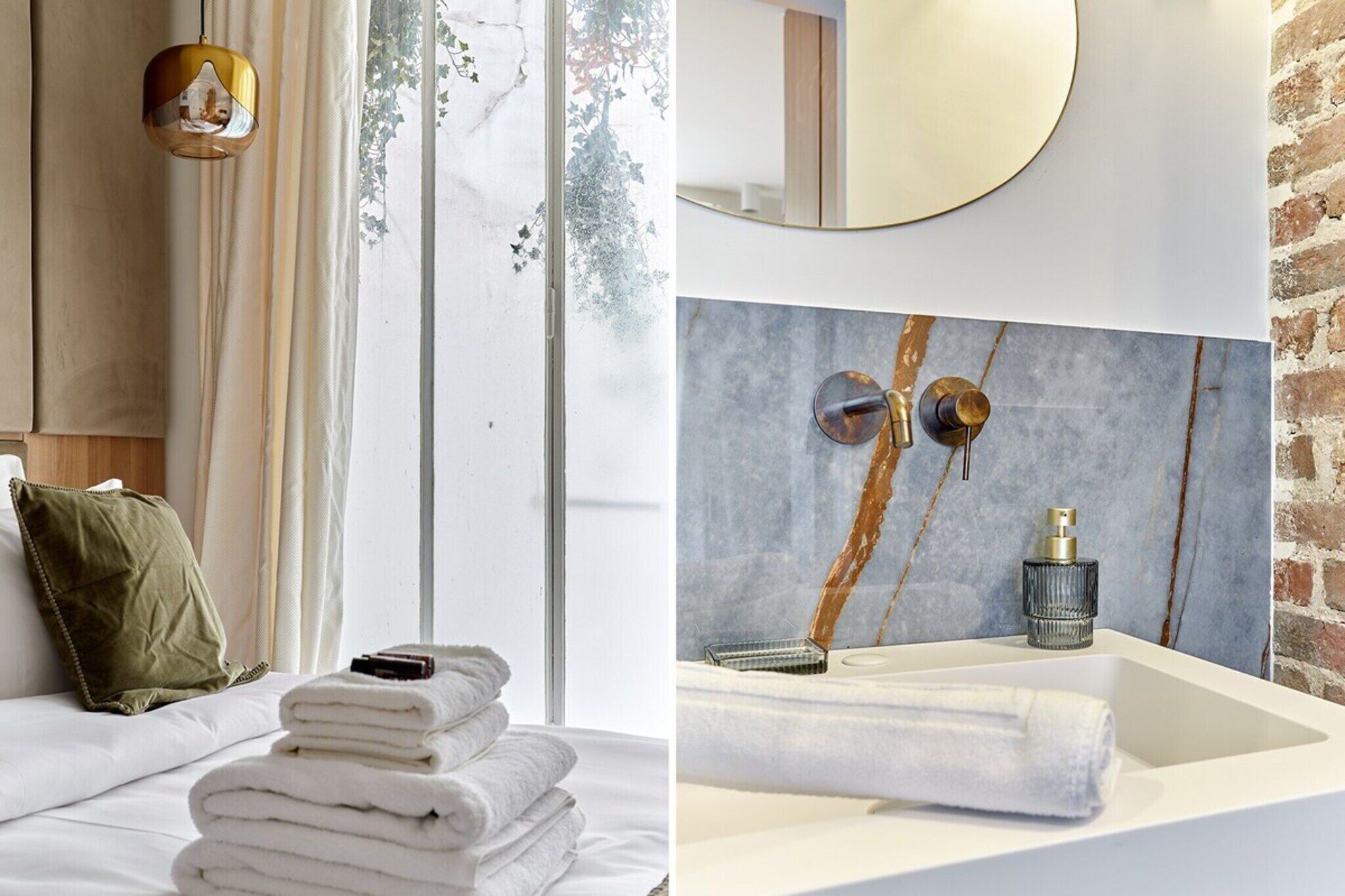 Une salle de bain moderne avec un lavabo en marbre, un miroir rond et un porte-serviettes.