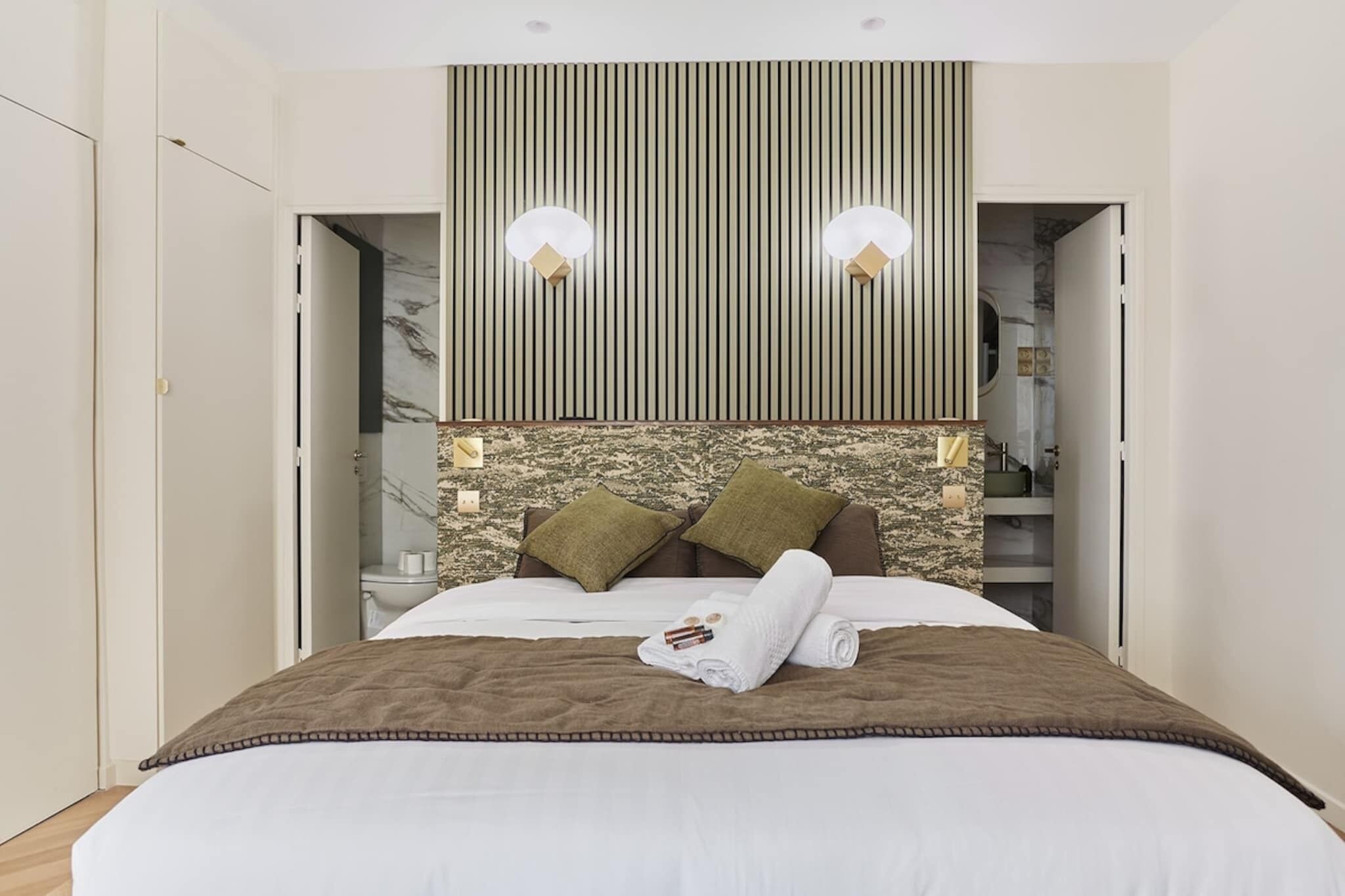 Desk, iron/ironing board, bed sheets