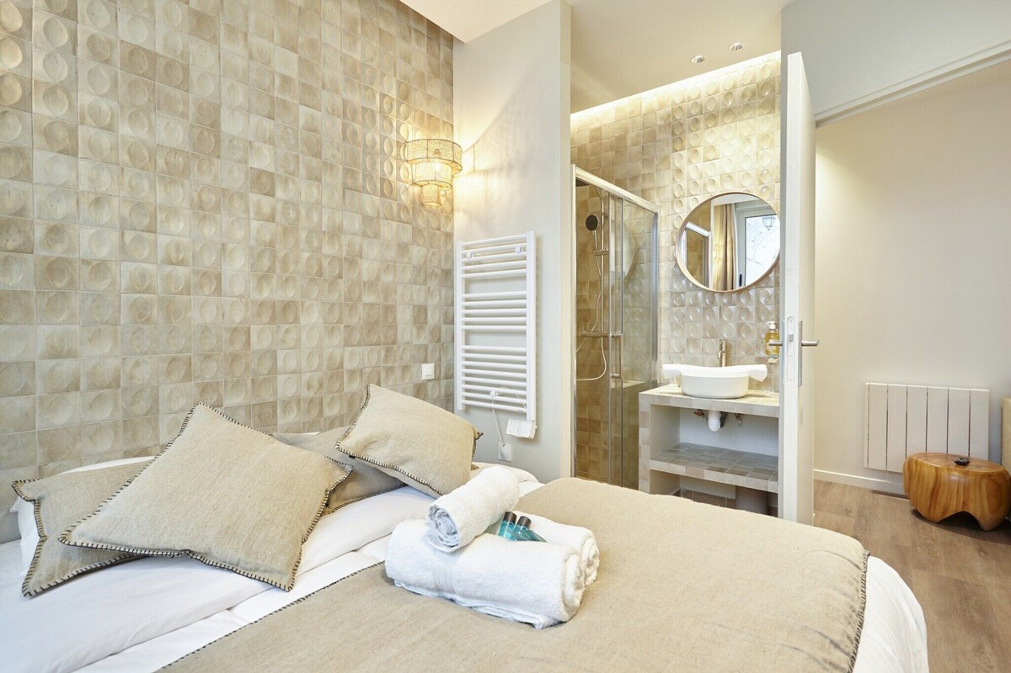 Desk, iron/ironing board, bed sheets