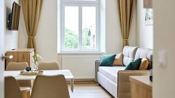 Standard Apartment, 1 Bedroom, City View | Living area | TV
