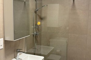Shower, hair dryer, towels, soap - Chic 1BR + Living Room Flat | Comfort & City Charm (Bratislava)