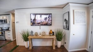 A modern kitchen with white cabinets, a microwave, and a built-in oven. - Xlnc Exotic Home Sunnyside by sdstay (San Diego)