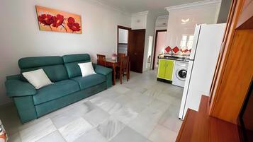 Comfort Apartment, Balcony, Sea View | Living area | 42-inch flat-screen TV with cable channels