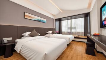 Classic Twin Room | Down comforters, desk, laptop workspace, blackout drapes