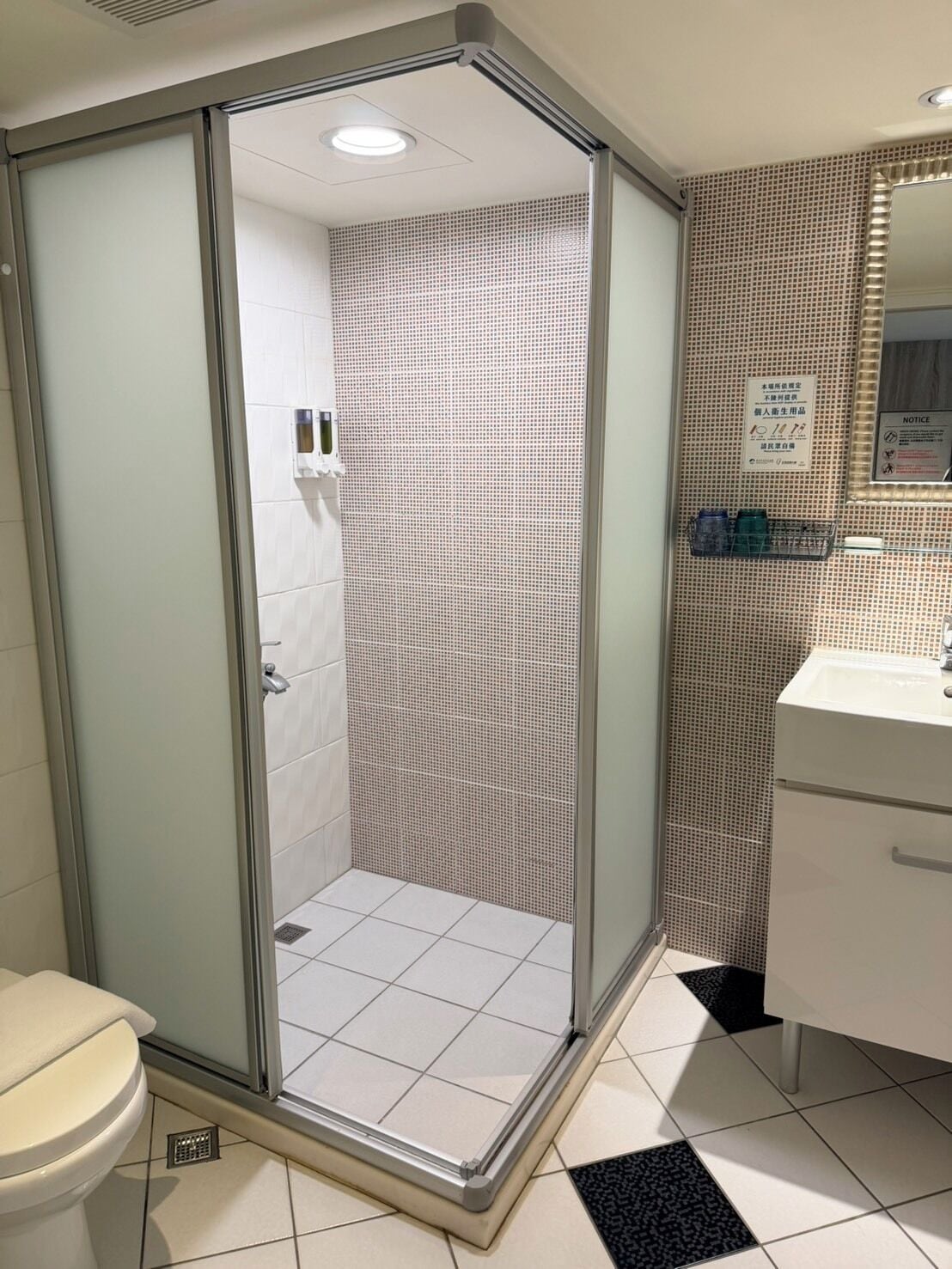 Shower, hair dryer, slippers, towels