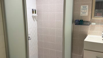 Shower, hair dryer, slippers, towels