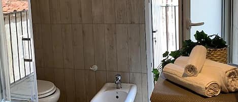 Apartment (1 Bedroom) | Bathroom | Shower, bidet, towels, toilet paper