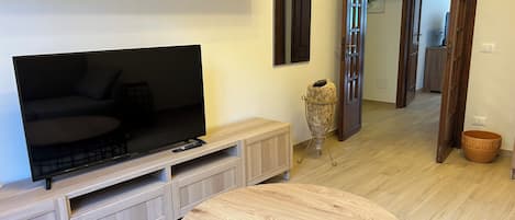 Apartment (1 Bedroom) | Living area | 32-inch flat-screen TV with cable channels
