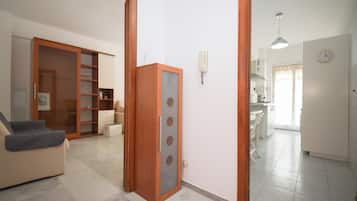 Apartment (2 Bedrooms) | Living area | 32-inch Smart TV with cable channels