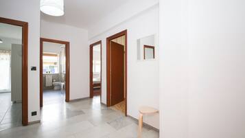 Apartment (2 Bedrooms) | Living area | 32-inch Smart TV with cable channels