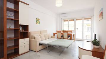 Apartment (2 Bedrooms) | Living area | 32-inch Smart TV with cable channels