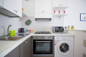 Fridge, microwave, oven, stovetop - Maniace Homes - Angelica by Ortigia Apartments (Syracuse)