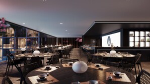 A modern restaurant interior with multiple dining tables, black chairs, and a sushi bar. - PORTO 2 LIFE RESORT (Ipojuca)