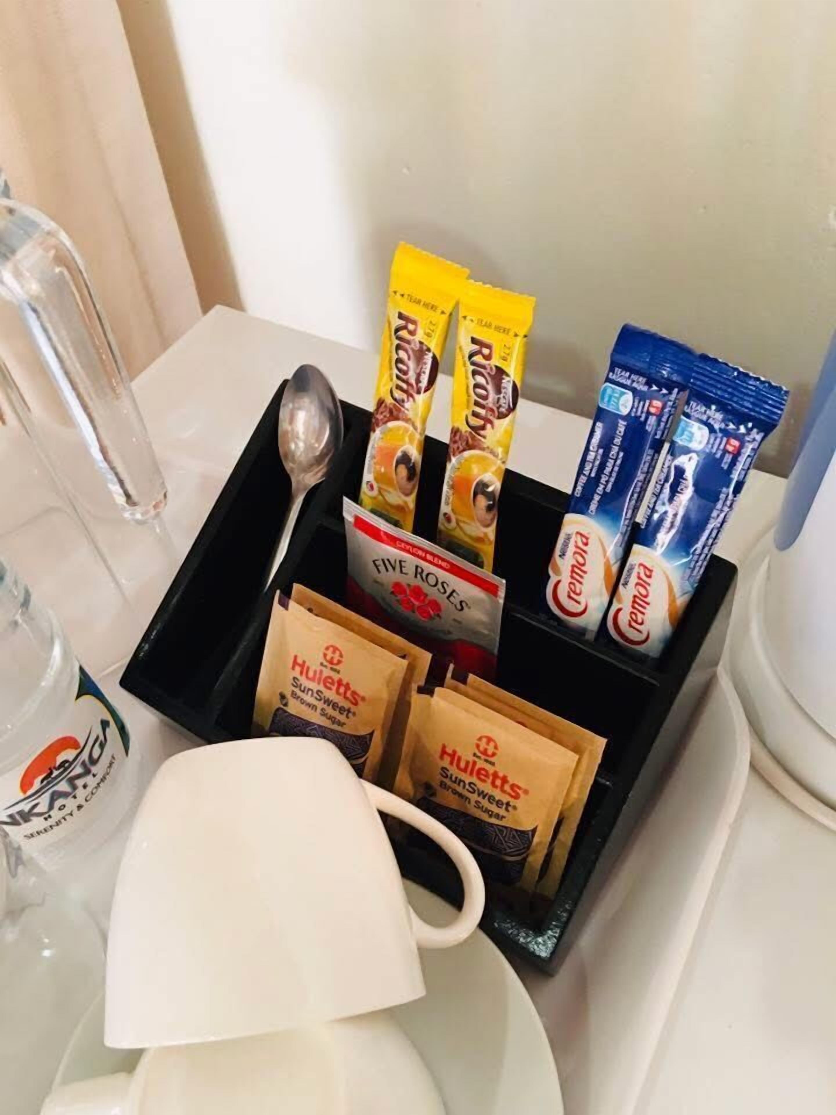A tray with food items including Cremera, Huillett's SunSweet brown sugar, and Riao.