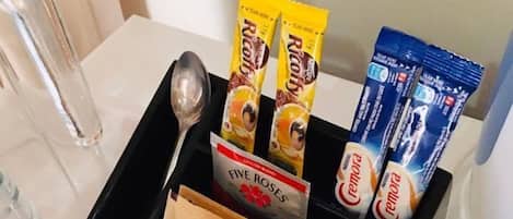 A tray with food items including Cremera, Huillett's SunSweet brown sugar, and Riao.