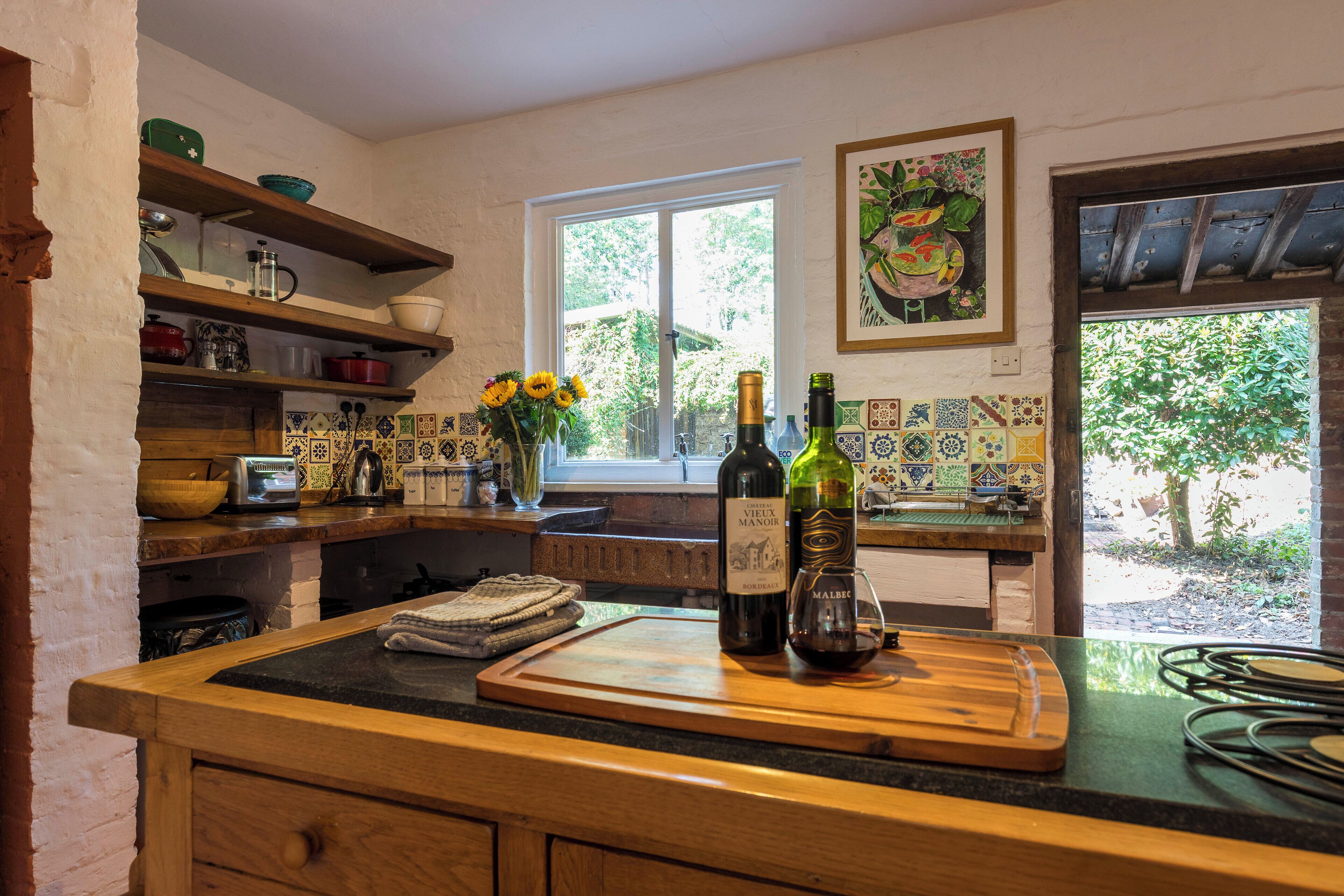 Fridge, stovetop, dishwasher, coffee/tea maker