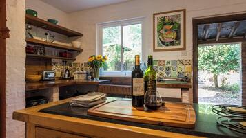 Fridge, stovetop, dishwasher, coffee/tea maker