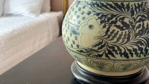 A ceramic vase with intricate blue patterns on a dark surface. - Charming 2BR in Columbia Walkable Pet-friendly (Bellingham)
