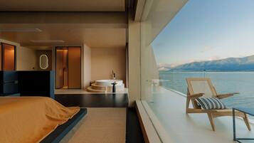 Habitación doble de lujo, balcón, vista al océano | Caja de seguridad en la habitación y escritorio