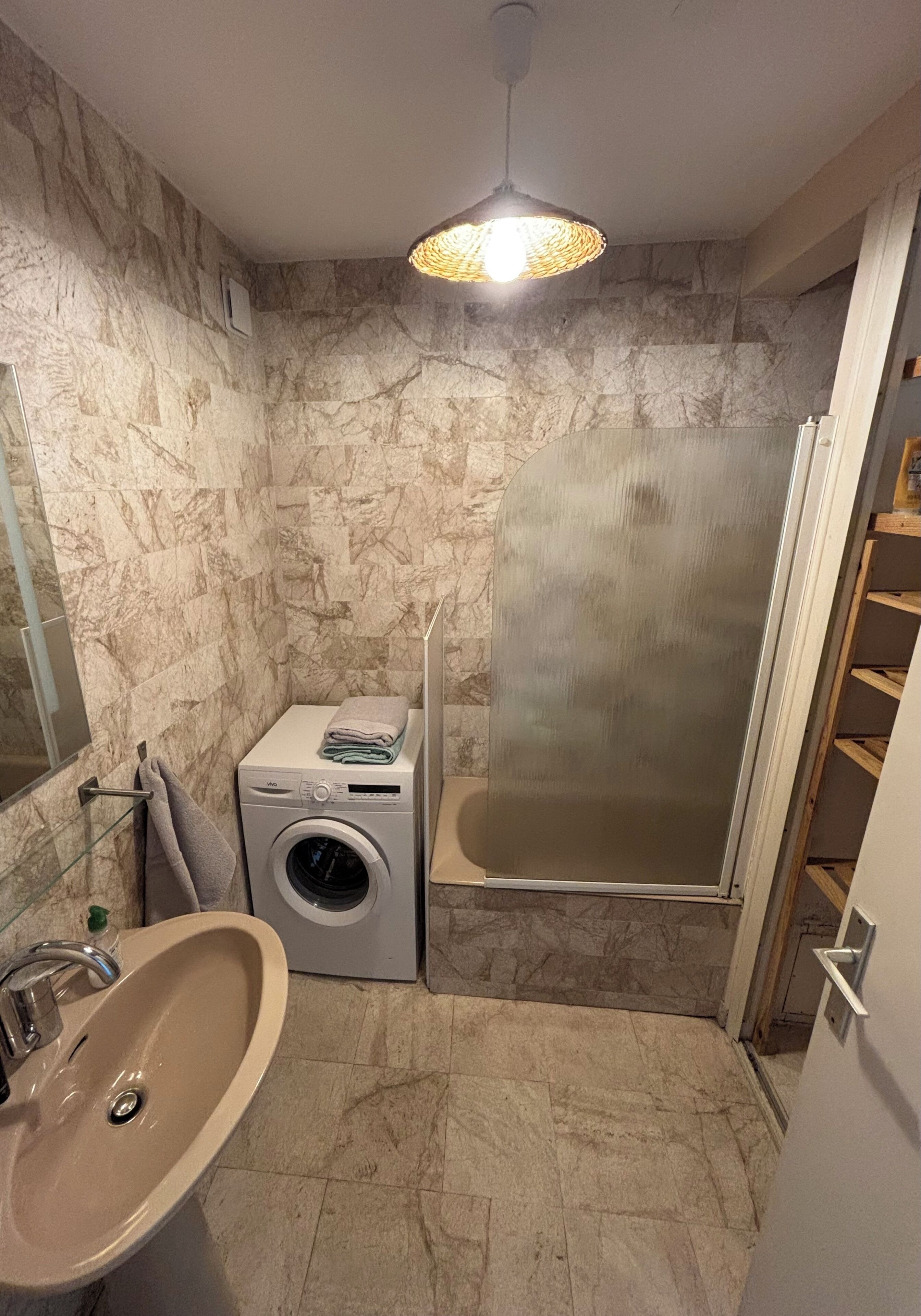 Shower, hair dryer, soap, toilet paper