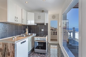 Fridge, microwave, oven, stovetop - Vacation Apartment 'Welcome to the Relax Zone' with Sea Views, Wi-Fi, and Air Conditioning (Los Caideros)