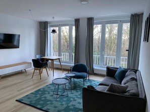 디럭스 아파트, 시내 전망 | 거실 공간