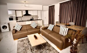 Deluxe Duplex, 3 Bedrooms, Balcony, City View | Living area | TV, printers - Le Basilic Addis Hotel Apartment & Spa (Addis Ababa)