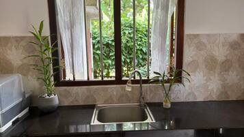 Fridge, microwave, stovetop, cookware/dishes/utensils