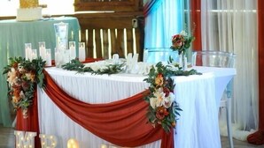 A wedding reception table with floral arrangements, candles, and illuminated letters spelling 'MR & MR'. - Sunshine Cabanas At Ocean View (Dangriga)