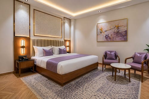 Executive Room | Draps en coton égyptien, literie de qualité, minibar