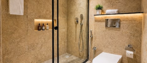 Shower, designer toiletries, hair dryer, bidet