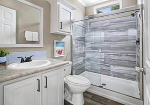 Shower, hair dryer, towels, soap
