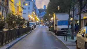 A city street lined with buildings, including a hotel with a sign. - PARIS ROOMS & DREAMS HOTEL (Paris)