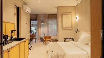 Standard Suite, 1 King Bed, Courtyard View | Minibar, in-room safe, desk, laptop workspace
