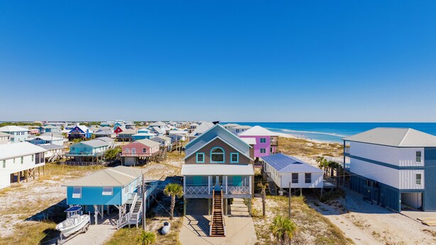 A coastal area with beach houses, some with balconies and a few with attached docks. - Gulf Views | Private Pool | Outdoor Kitchen (Fort Morgan)