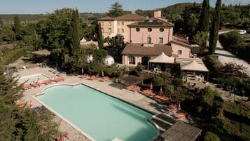 Seasonal outdoor pool, open 10:00 AM to 7:00 PM, pool umbrellas