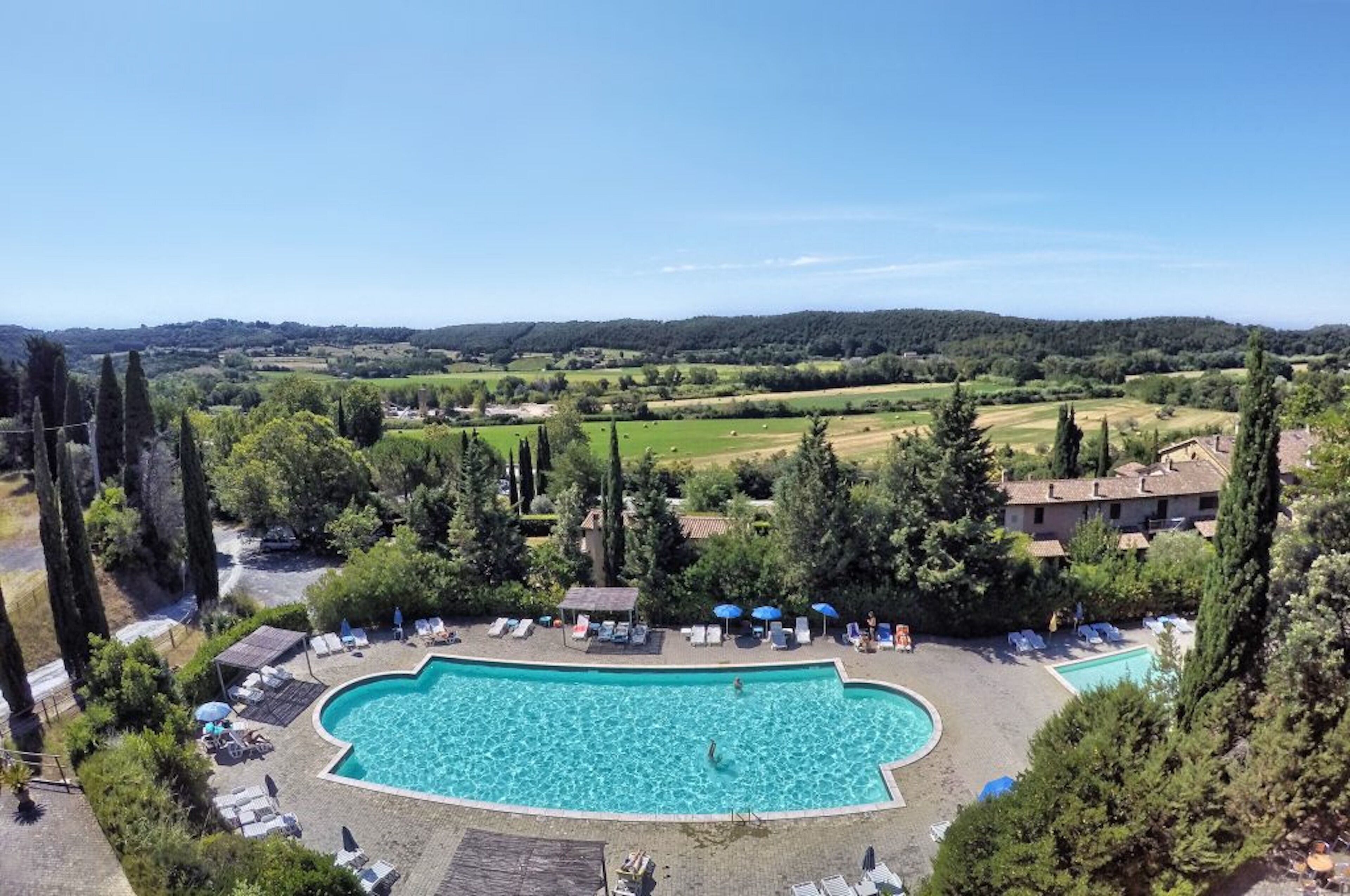 Seasonal outdoor pool, open 10:00 AM to 7:00 PM, pool umbrellas