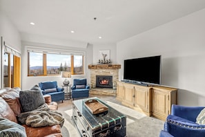 TV, fireplace - Base Area Condo~Steps to Ski~Pool, Hot Tubs, 2 Patios (Steamboat Springs)