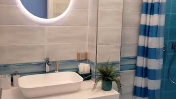 Hair dryer, towels, soap, shampoo