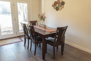 Dining - Spacious 5-bedroom, 2-bath retreat that comfortably hosts up to 12 guests. Unwind along Dry Elm Creek, soak in the wide-open skies, and explore nearby Muenster—home to charming local dining, 4R Ranch Vineyards, and Turtle Hill Golf Course. (Muenster)