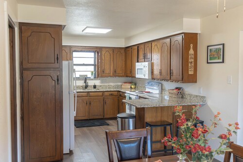 Spacious 5-bedroom, 2-bath retreat that comfortably hosts up to 12 guests. Unwind along Dry Elm Creek, soak in the wide-open skies, and explore nearby Muenster—home to charming local dining, 4R Ranch Vineyards, and Turtle Hill Golf Course.