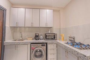 Apartamento standard, sacada, vista para o jardim | Cozinha privada