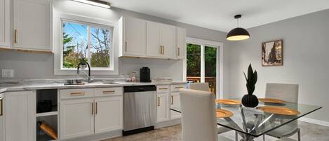 Dishwasher, coffee/tea maker, cookware/dishes/utensils, dining tables