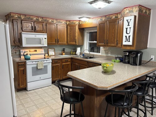 Spacious Mackinaw Avenue Creekside Cottage