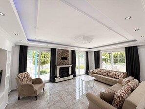 TV, fireplace - Villa Fergana - Six Bedroom Villa, Sleeps 12 (Oludeniz)