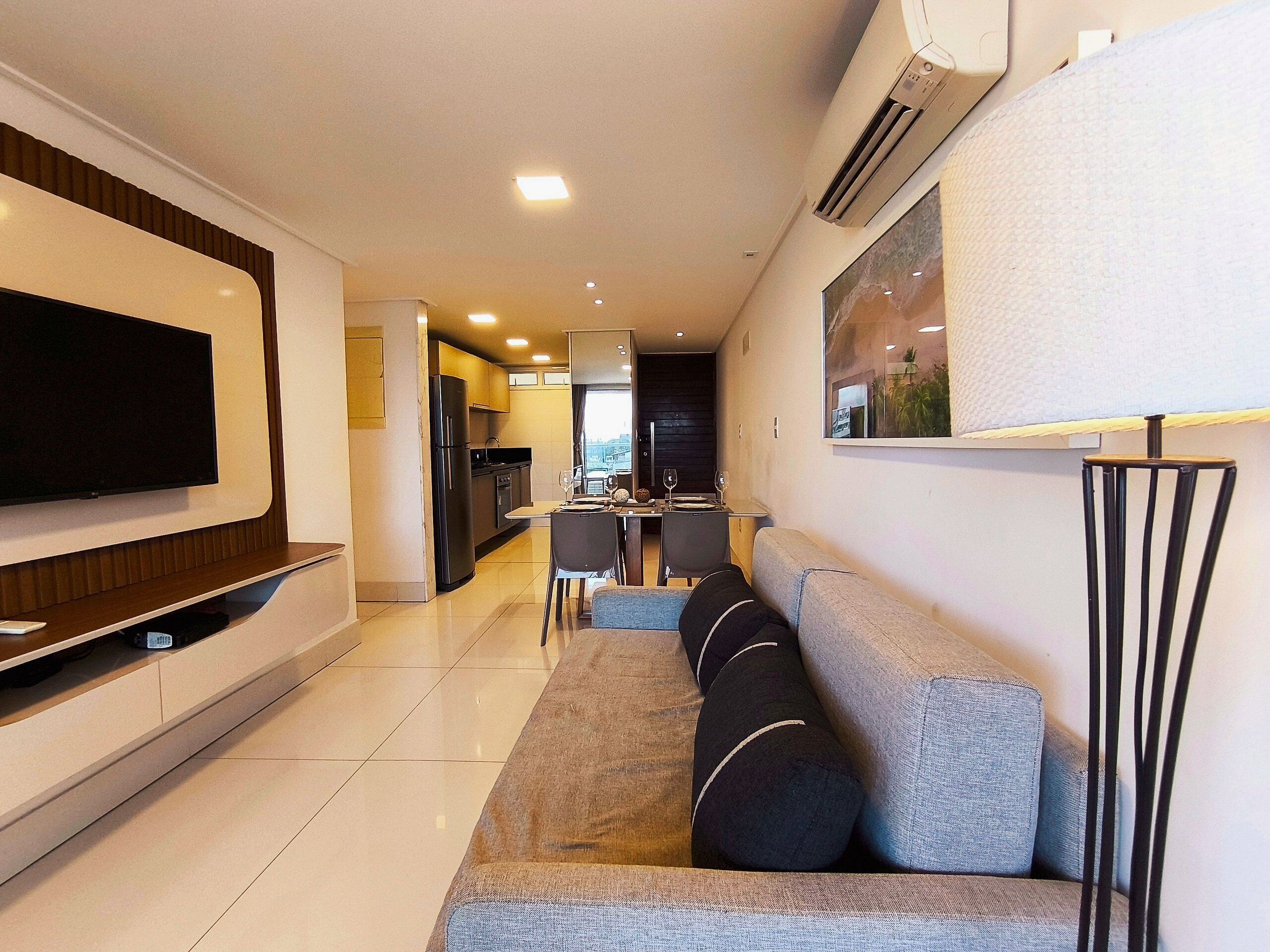 Deluxe Apartment | Living area | Flat-screen TV